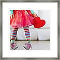 Young girl wearing colorful tights Framed Print