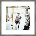 Young Man Doing Lunges With Dumbbells In Gym In Garage Framed Print