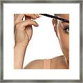 Young Woman Contouring Her Eyebrows With Dry Brush On White Background Framed Print