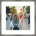 Young Woman Protester Raising Her Fist Up Framed Print
