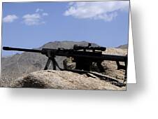 A Barrett .50-caliber M107 Sniper Rifle sits atop an observation point in  Afghanistan Solid-Faced Canvas Print