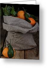 Fresh tangerines in a bag of coarse fabric. Photograph by Sergei Dolgov -  Pixels