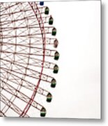 A Large Ferris Wheel On A Cloudy Day Metal Print