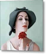 A Model Wearing A Hat And Holding A Flower Metal Print