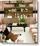 A Woman Reading Magazines On The Floor Metal Print