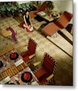 A Woman Sitting On The Floor Of Her Living Room Metal Print
