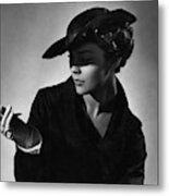 A Young Model Wearing A Black Hat And Holding Metal Print