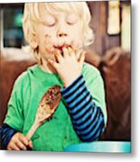 Child Enjoying Eating Chocolate Metal Print