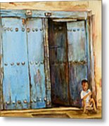 Child Sitting In Old Zanzibar Doorway Metal Print
