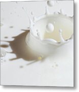 Close-up Of Milk Splashing Metal Print