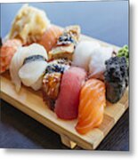 Close-up Of Sushi Set On Wooden Board Metal Print
