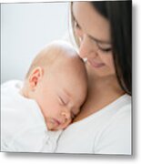 Close-up On A Mother Carrying Her Baby At Home Metal Print