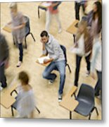 College Students Moving Around Man At Desk In Classroom Metal Print