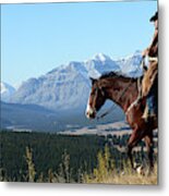 Cowboy Riding With A View Of The Rocky Metal Print