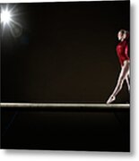 Female Gymnast Balancing On Beam Metal Print