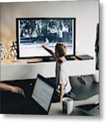 Full Length Of Boy Kneeling While Touching Smart Tv In Living Room At Home Metal Print