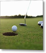Golf Ball At Edge Of Hole On Green Metal Print