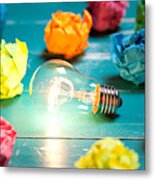 Incandescent Bulb And Colorful Notes On Turquoise Wooden Table Metal Print