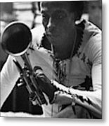 Jazz Musician Miles Davis Looking At His Trumpet Metal Print