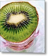 Kiwi Fruit On A Pink And Blue Glass Plate Metal Print