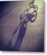 Long Shadow Of Child Riding A Bicycle Metal Print