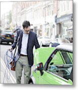 Man Charging Electric Car On Street Metal Print