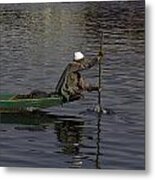 Man Plying A Wooden Boat On The Dal Lake Metal Print