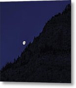 Moon Setting Behind The Rockies Metal Print