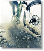 Mountain Biker Racing Through Puddle Metal Print