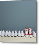 Pair Of Shoes In Row Against Wall Metal Print