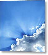 Rays Of Light Behind Clouds In A Blue Metal Print
