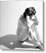 Sad Woman Sitting On Floor And Holding Head In Hands Metal Print