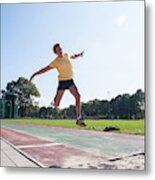 Senior Athlete (75) Practicing Long Jump Metal Print