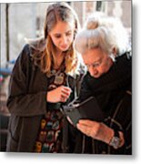 Senior Lady And Grandchild Looking At Smartphone Metal Print