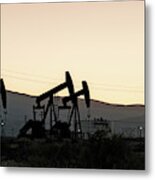 Silhouette Of Oil Rigs At Sunset Metal Print