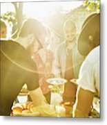 Smiling Friends Dishing Up Food In Backyard On Summer Evening Metal Print