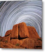 Star Trails Above A Large Boulder Metal Print