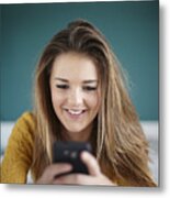 Teenage Girl In Bedroom Texting On Smartphone Metal Print
