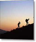 Two Men And One Woman Run Up A Mountain Metal Print