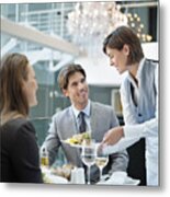 Waitress Serving Food To Couple In Restaurant Metal Print