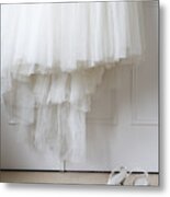 White Shoes On Floor Beneath Wedding Dress Hanging Outside Wardrobe Metal Print