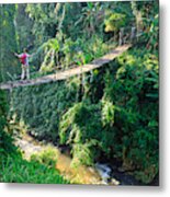Woman With Backpack On Suspension Bridge In Rainforest Metal Print