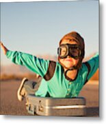 Young Boy With Goggles Imagines Flying On Suitcase Metal Print