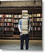 Young Man Carrying Stack Of Books In University Library Metal Print