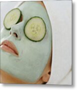 Young Woman Lying Down With A Face Pack And A Towel Wrapped Around Her Head Metal Print