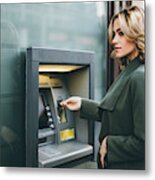 Young Woman Using Atm Metal Print