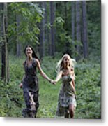 Young Women Running Through Forest Metal Print