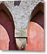 Ornate Design Of Carved Stone Arch Against A Red Faded Plaster Wall Metal Print