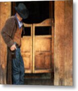 Cowboy By Saloon Doors Metal Print