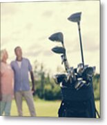 Golf Bag Standing On A Grass Field, People In The Background Metal Print